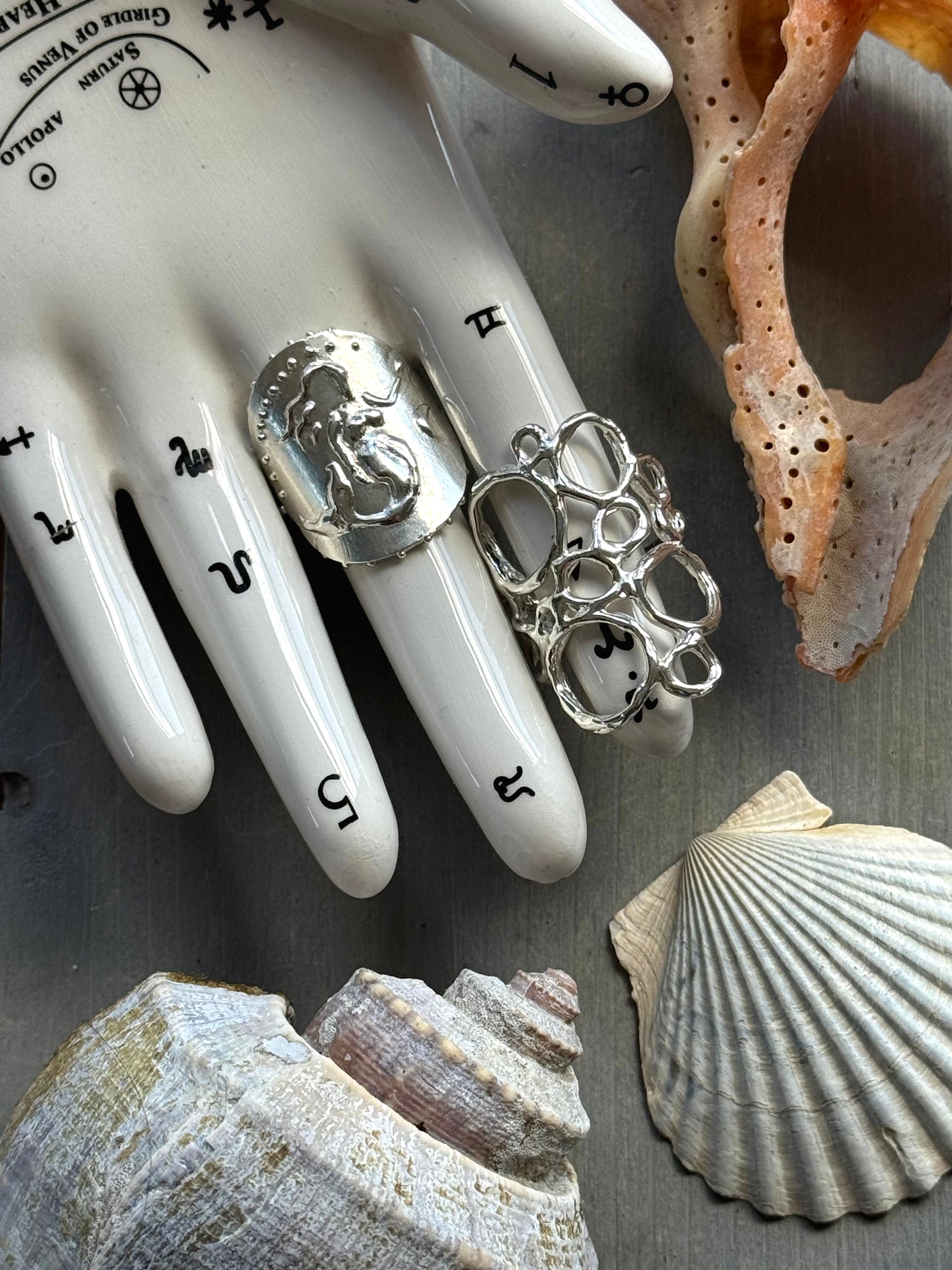 SeaSpell Mermaid and Ecume Silver Rings on tarot hand with Shells