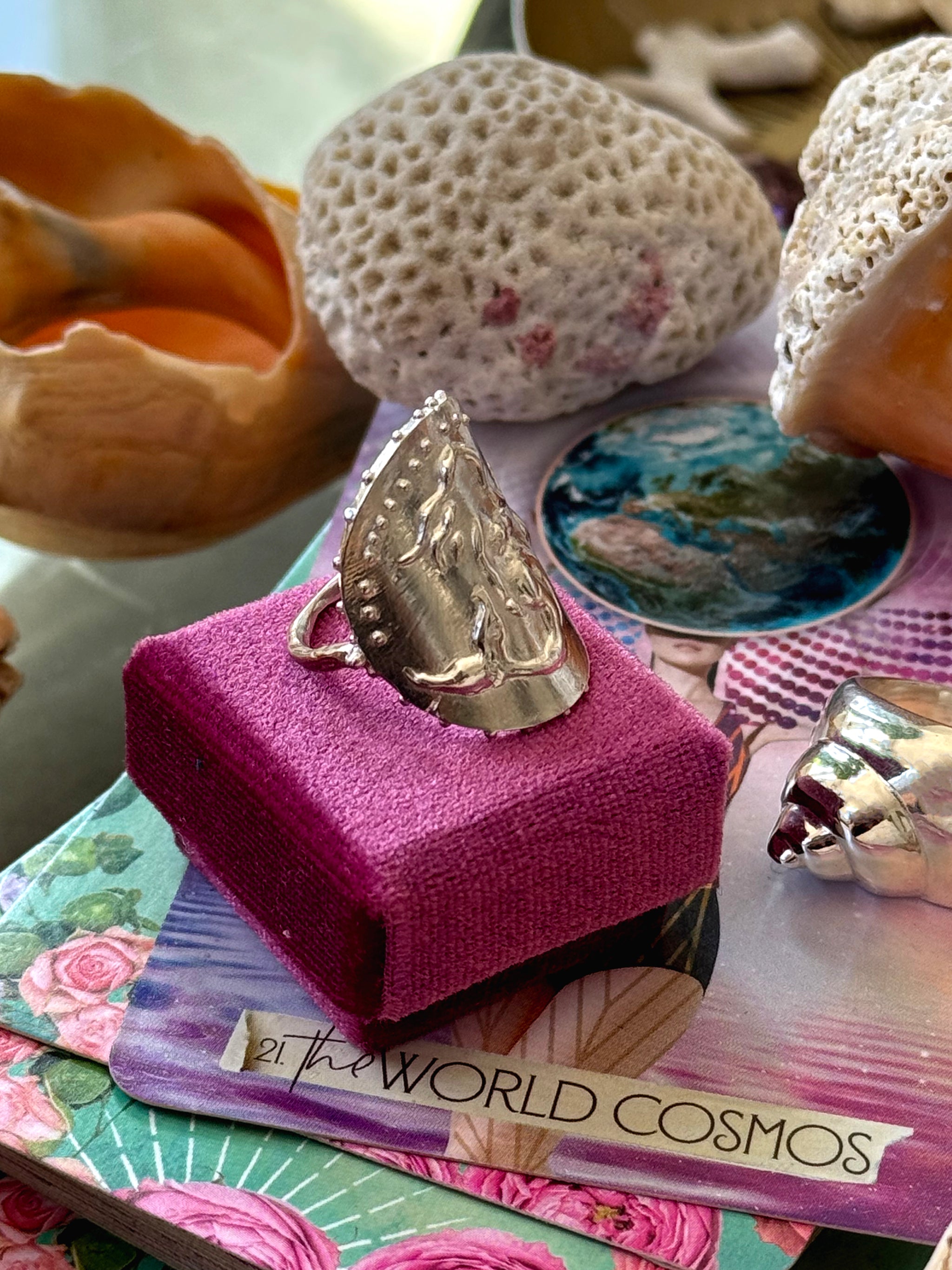 Side view of SeaSpell Silver Mermaid Ring in pink Velvet box with Shells and tarot card