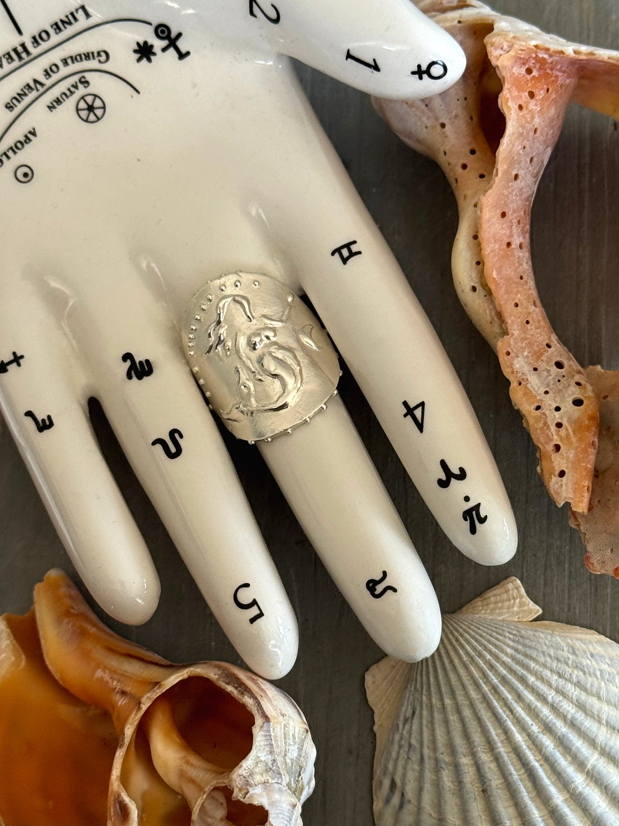 SeaSpell Mermaid Silver Ring on tarot hand with Shells