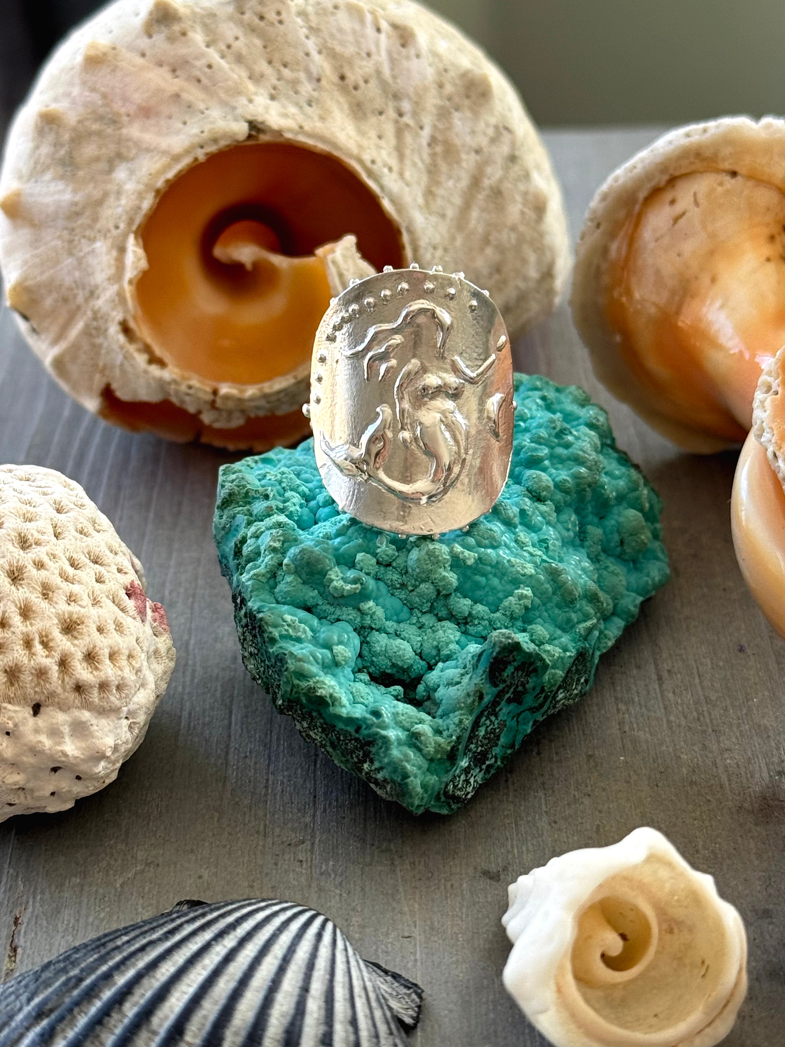 SeaSpell Mermaid and Ecume Silver Rings on tarot hand on truqoise rough with Shells