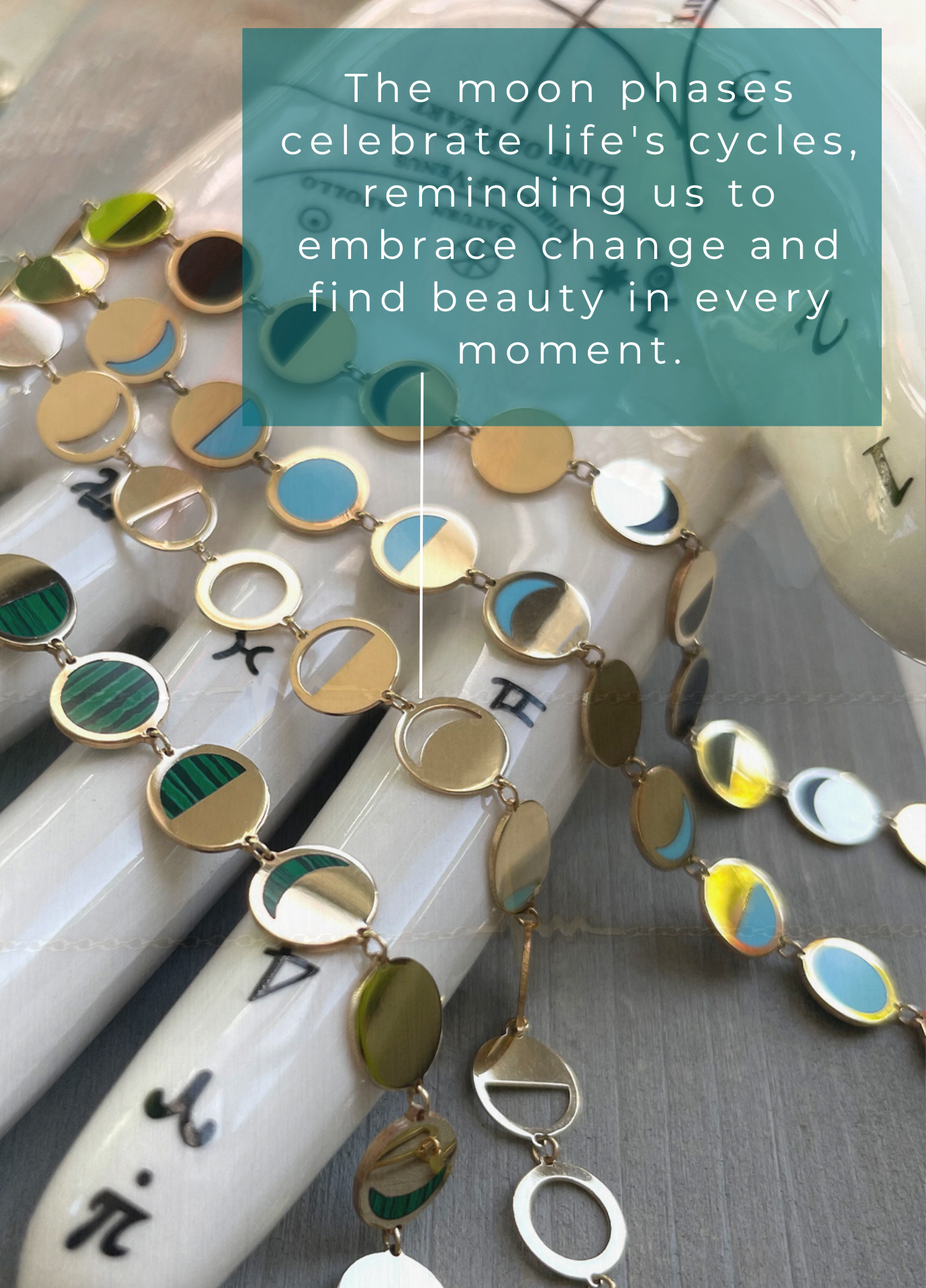 18k yellow gold die cut moon phase necklaces on a porcelain hand, with a motivational quote about moon phases.