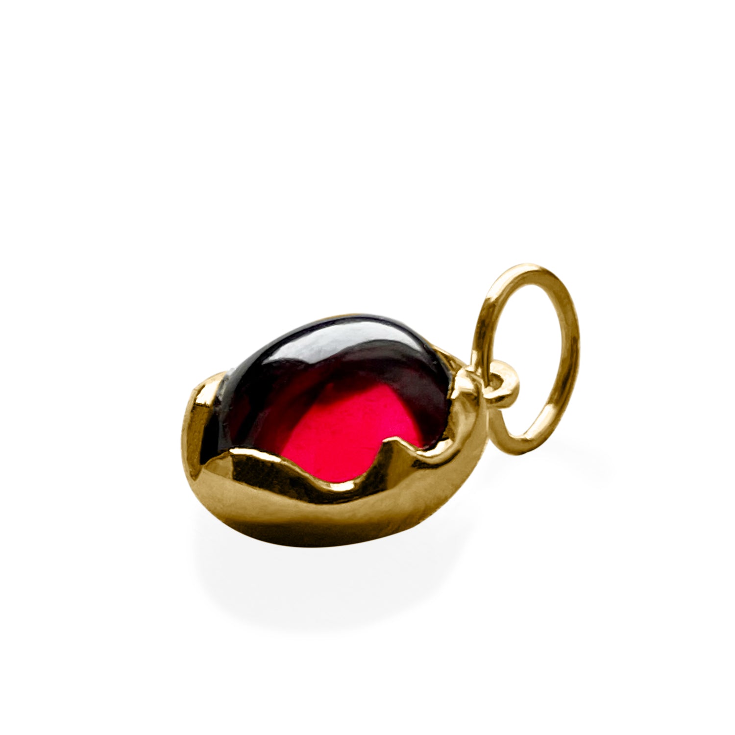 sideway view of the red garnet Lotus charm, witrh the light going through the red cabochon gem