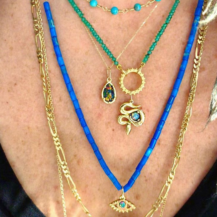 Layered necklaces worn on model